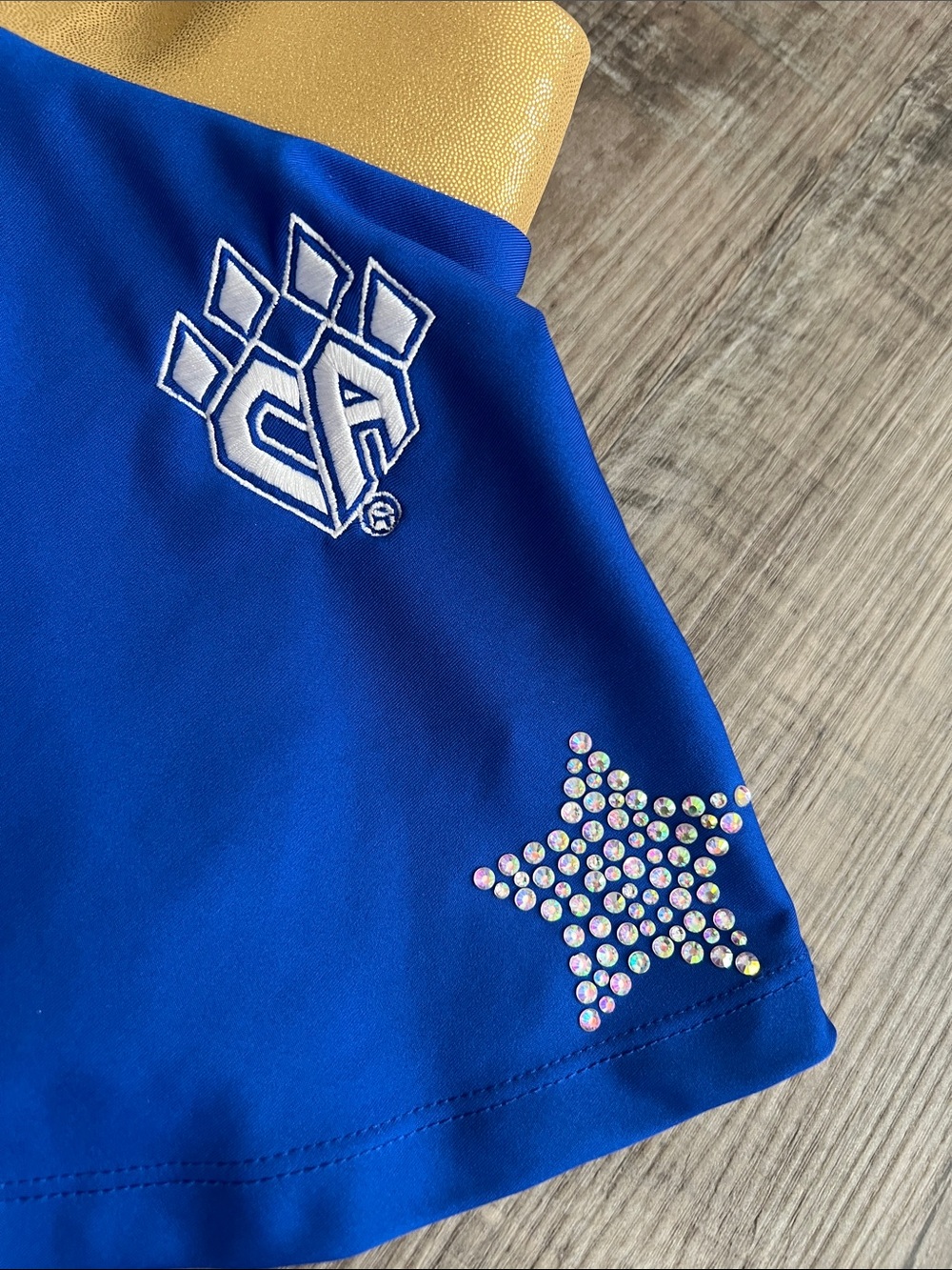 Cheer Athletics gold and royal blue skort with rhinestone stars size Youth L - Picture 2 of 16